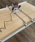Dead On Precision Router Sled For Wood Slab Flattening Mill with 20mm steel rails and trimmer on a smooth surface.