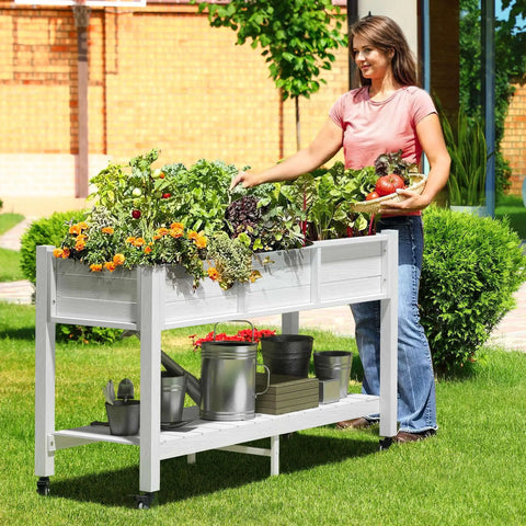 Raised Garden Bed On Wheels With Legs And Lockable Casters, Weather Resistant HDPE Elevated Planter Box, Double Tier Poly Wood Garden Bed For Backyard, Patio Or Balcony, Easy Mobility And Durable Outdoor Use, woman tending plants