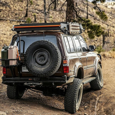 4x4 vehicle with mounted Portable 5 Gallon Military Style Water Jug For Camping And RVs Sand Colored Plastic Beverage And Hydration Dispenser