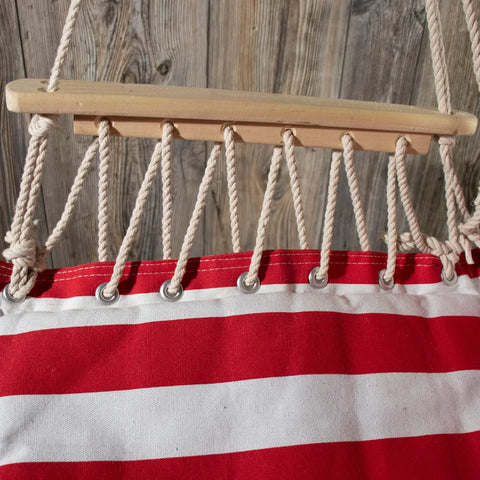 Cozy Hammock Chair With Armrest Support Indoor Outdoor Rope Swing, red and white fabric close-up, wood bar detail