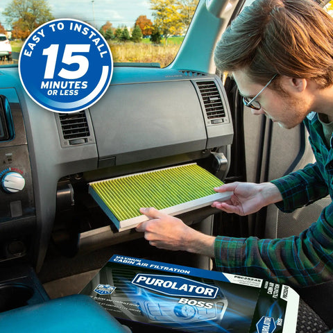 Man installing Boss Automotive Cabin Air Filter With Febreze And Activated Carbon For Tesla Model 3 And Model Y in car dashboard