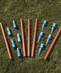 Lightweight Dog Agility Slalom Kit With Carry Bag For Backyard Training And Fun, stakes and poles laid out on grass