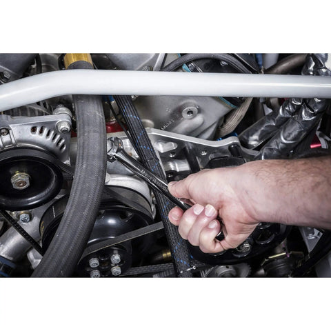 Ratcheting Combination SAE and Metric Wrench Set, Ten Piece, 12 Point, 72 Tooth Box End, in use on car engine bolt