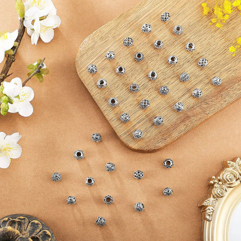 60 Pieces Dope Silver Tone Filigree Spacer Beads Set Hollow Tibetan Alloy Beads In 10 Styles 10 Mm Tiny Metal Beads displayed