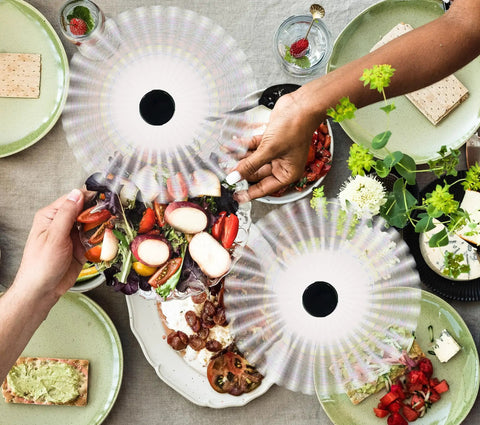 Fly Swatter And Battery Powered Food Spinning Fans Set Of 2 for tables with safe soft blades above picnic food on a table.