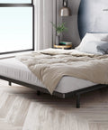 Heavy Duty Queen Bunkie Board And Thick Steel Frame Mattress Support on a bed with a soft beige blanket.