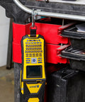 Built Tough Portable Handheld Label Maker With Rechargeable Battery hanging from a cart, showcasing its screen and keypad.