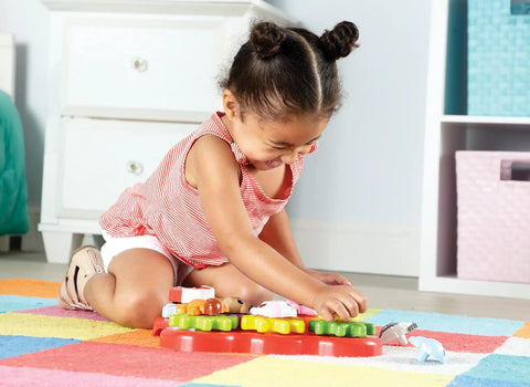 Toddler playing with Toddler Sensory Gear Board Toy Set for Preschool STEM Fun Build and Spin Kid Friendly Barnyard Animals.