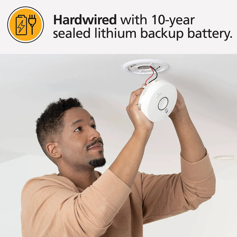 Man installing 2 In 1 Smoke Detector And Indoor Air Quality Monitor With WiFi And Alexa Compatibility Hardwired With Battery Backup
