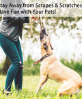Person wearing heavy duty cut resistant arm sleeves with thumb hole, interacting with a dog outdoors.