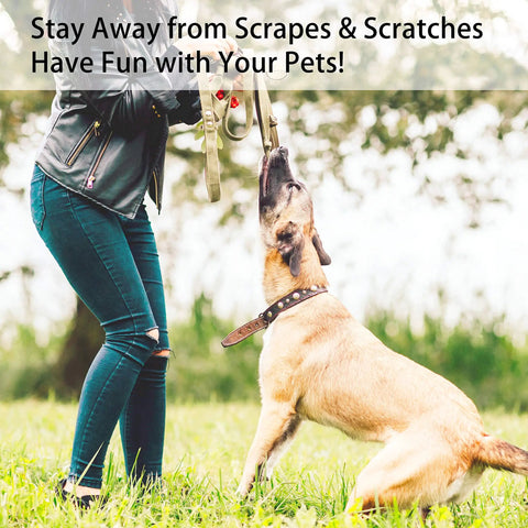 Person wearing heavy duty cut resistant arm sleeves with thumb hole, interacting with a dog outdoors.