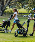 Parents pushing strollers with Stroller Golf Bag Organizer that holds a full set of clubs, includes accessory pockets, converts to carry bag.