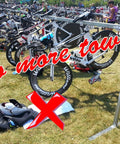 Bikes in crowded triathlon transition area, Large Neoprene Triathlon Transition Mat Teal Blue For Crowded Transitions Wetsuit Changing Pad visible on ground