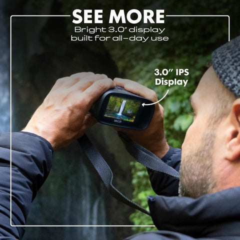 Person using 10x25 Digital Night Vision Monocular With Built In 4K HD Video Camera Black with 3.0 IPS display for observation.