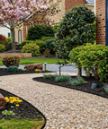 Garden path edged with No Dig Landscape Edging Kit 1.5 Inch By 100 Foot With 150 Spikes, Hammer And Gloves in residential yard
