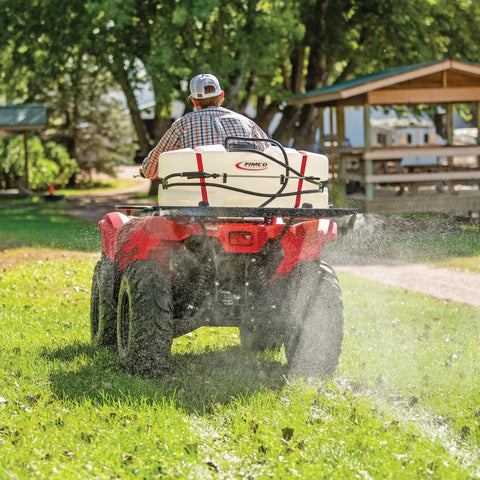 ATV Sprayer 2.4 GPM High Flo Pump, 12V Self Priming, 60 PSI, 15 Gallon Tank mounted on ATV in use on grass field