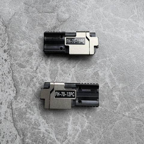 Kickass Pitch Conversion Fiber Holders Paired With Slick Sheath Clamps For Fast Glueless Ribbonizing Of 200 Micron Loose Optical Fibers S017464 FH7012PC Left Right Coded Jigs on gray background.