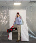 Man walking through ZipDoor ZDM Magnetic Door Kit Self Closing Magnets Temporary Door For Dust Barriers Easy Install White 1 Pack