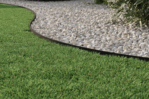 4 Inch Composite Landscape Edging Kit With 40 Foot Roll And 24 Anchoring Stakes Contractor Grade Black edging on grass and gravel border