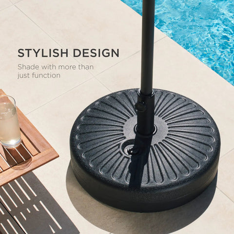 Fillable Round Sunburst Umbrella Base Stand With 55 Pound Weight Capacity, Plastic Patio Pole Holder next to pool.