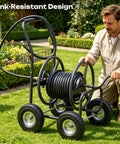 Man using Garden Hose Reel Cart With 250 Ft Capacity, 10 Inch Pneumatic Tires, Powder Coated Steel Frame in a garden