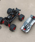 Quake GROM 4x4 RC Monster Truck One Sixteenth Scale Ready To Roll chassis and body shell separated view