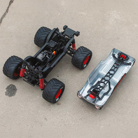 Quake GROM 4x4 RC Monster Truck One Sixteenth Scale Ready To Roll chassis and body shell separated view