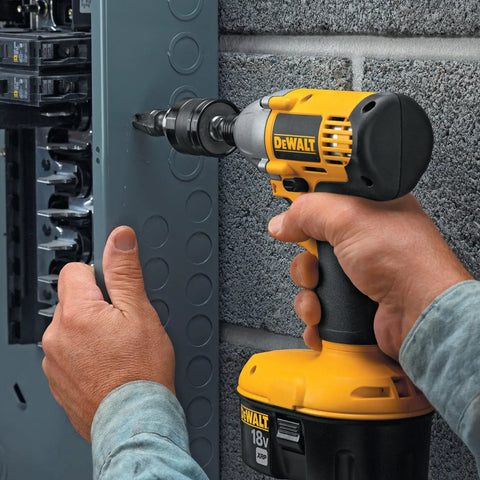Hand using DeWalt impact driver with Impact Driver Drill Chuck With One Quarter Inch Quick Connect on grey panel