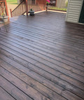 Dark Walnut Wood Stain For Decks And Fences Penetrating Semi Transparent Finish applied on wooden deck showcasing rich tone and grain.