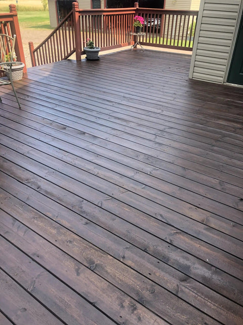 Dark Walnut Wood Stain For Decks And Fences Penetrating Semi Transparent Finish applied on wooden deck showcasing rich tone and grain.