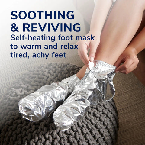 Person using Cozy Self-Heating Tired And Achy Feet Soothing Foot Mask With Warming Booties Moisturizing Socks Infused With Epsom Salt