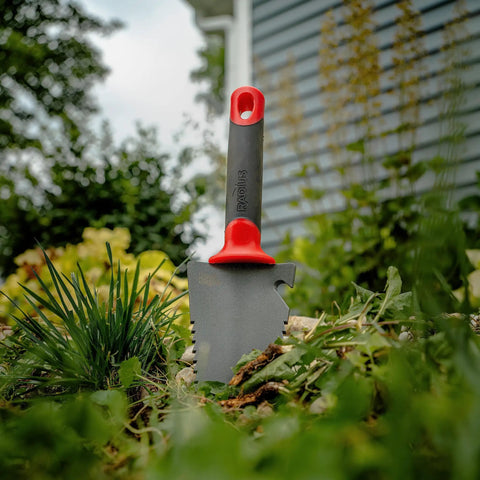 Heavy Duty Garden Trowel With Serrated Blade For Digging And Root Cutting Carbon Steel Hand Tool with red handle in soil