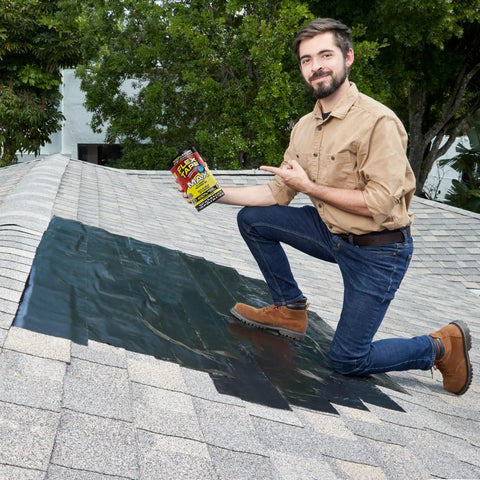 Person on roof with Thick Rubberized Waterproof Tape That Patches Leaks, Seals And Repairs Virtually Anything, Works Underwater And On Indoor Or Outdoor Surfaces, Ideal For Home, RV Roof, Plumbing And Pool Repairs, Black, 12 In By 10 Ft applied on shingles