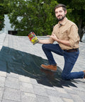 Person on roof with Built Tough Max Strength Waterproof Tape For Leaks That Seals And Patches On Wet Surfaces Underwater Ready Rubberized Black Tape For Indoor Outdoor Repairs On Roofs Pools And RVs 8 In By 25 Ft Pack Of 1 in hand