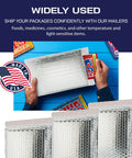 Person holding Heavy Duty Insulated Silver Thermal Bubble Mailers 8x11 Self Sealing Padded Envelopes for cold shipping