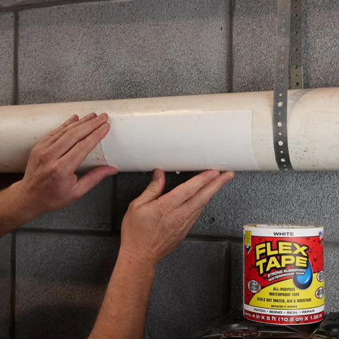 Applying thick rubberized waterproof tape that seals leaks, patches cracks, and repairs like a pro, even underwater, on a pipe.