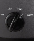 Close-up of control dial showing Off, Low, High, and Warm settings on Huge 7 Quart Manual Slow Cooker Serving As A Real Weeknight Hero With Removable Stoneware Pot, High And Low Settings Plus Auto Warm Mode, No Fuss Dishwasher Safe Cleanup, Charcoal Finish.