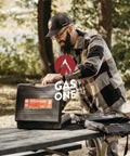 Person opening case of Dual Fuel Camping Stove For Propane Or Butane With Piezo Ignition, Portable Stove With Carrying Case And Regulator