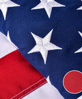 Close-up of Outdoor 3x5 Ft American Flag Deluxe Heavy Duty Spun Polyester showing embroidered stars and tearproof material texture.