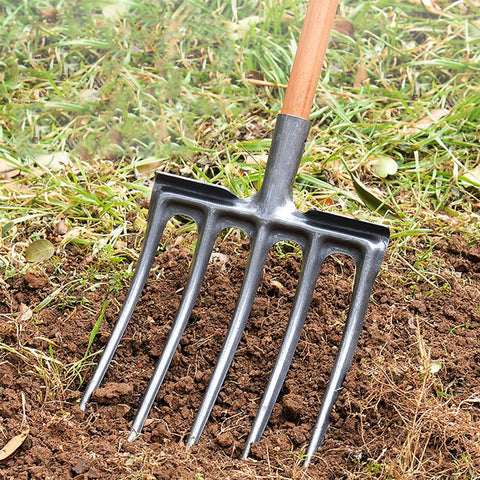 Heavy Duty Garden Digging Fork With Four Tine Spading Fork High Carbon Steel Construction breaking hard soil in garden