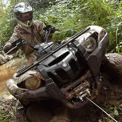 Vantage 4000 12V DC Electric Winch for ATV UTV Side By Side With 55 Ft Aircraft Grade Wire Rope And Roller Fairlead For Off Road Recovery And Heavy Duty Tasks mounted on mud-covered ATV
