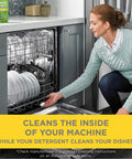 Woman using Odor Busting Dishwasher Cleaner Tablets Six Month Supply Clears Mineral Deposits Limescale And Grime From Pumps Tubes And Hoses Six Tablets Pack For Most Dishwashers.