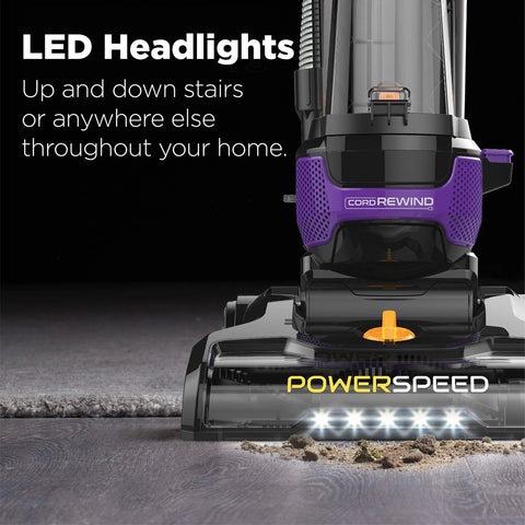 Upright vacuum cleaner, purple PowerSpeed with LED headlights and cord rewind, front view.