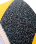 Close-up of Heavy Duty Anti Slip Grip Tape 6 Inch By 30 Ft Black And Yellow Striped 80 Grit Aluminum Oxide Industrial Grade