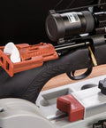 Close-up of Rapid Deluxe Bore Guide Kit with four muzzle guides on a rifle for precise cleaning rod alignment.