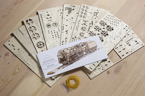 Handcrafted Locomotive With Tender Mechanical 3D Puzzle, Wooden Construction Set For Adults, Realistic Steam Train Build Kit, Perfect Gift For Christmas And Thanksgiving, Great For Craft Lovers, wooden parts and instructions laid out
