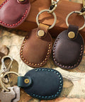 Premium Handmade Genuine Leather AirTag Holder And Keychain With Heavy Duty Rings Protective Case Compatible With Apple AirTags First And Second Gen Straight Up Solid Brown, featuring various colors.