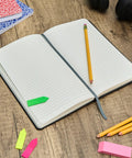 Logistics Nerds Journal For Supply Chain Ops Hardcover With 240 Lined Pages Elastic Closure Ribbon Bookmark Expanding Inner Pocket And Pen Holder Black open on desk