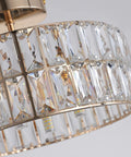 Close-up of 68 K5 crystals in a lit rose gold semi flush mount crystal ceiling light with modern chandelier details.