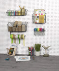Straight Up Heavy Duty Wire Pegboard Wall Basket Rock Solid Metal Storage Bin For Garage Tools And Workshop Gear Super Handy Dual Mount Setup In Industrial Gray with assorted craft supplies on a pegboard.